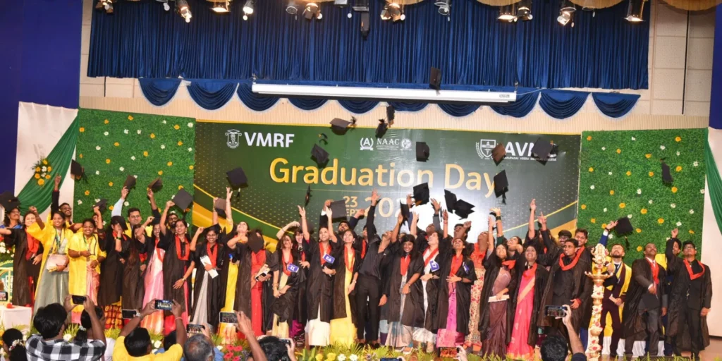 Graduates tossing their graduation hats